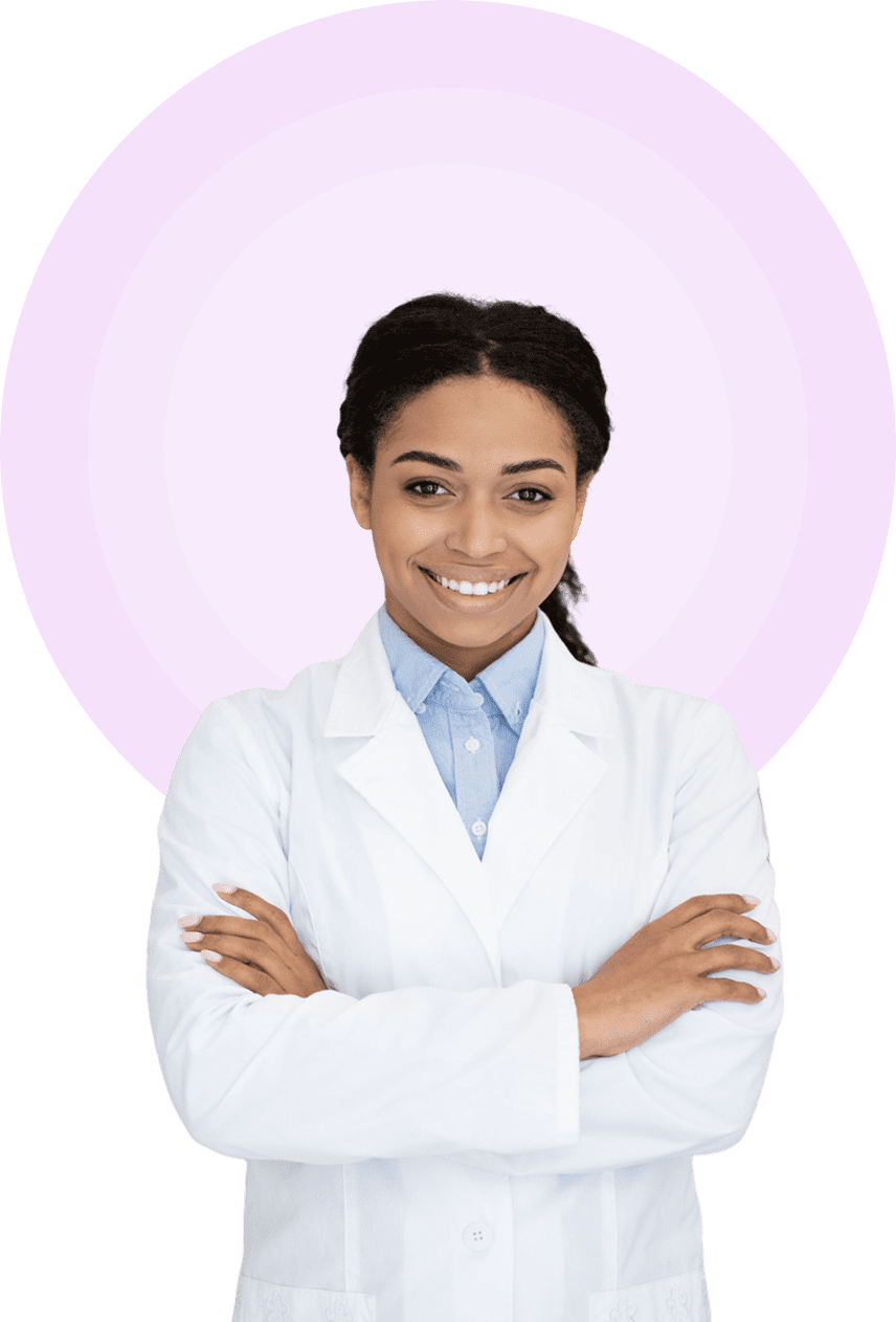 A woman in white lab coat with arms crossed.